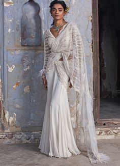 Off White Shimmer Drape Saree Set With Embellished Belt Nitika Gujral - Fabilicious Fashion Luxury White Georgette Pre-draped Saree, Luxury Silver Pre-draped Saree With Pallu, Luxury White Embroidered Pre-draped Saree, Luxury White Traditional Wear With Weaving Work, Luxury Fitted Silver Pre-draped Saree, Luxury White Pre-draped Saree With Zari Weaving, Luxury White Saree With Traditional Drape, Luxury White Saree In Traditional Drape, Luxury White Bollywood Style Pre-draped Saree