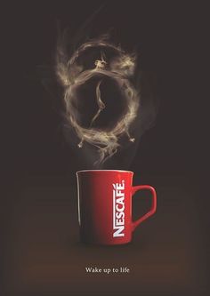 a red coffee cup with steam rising out of it