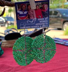 Handmade African beaded earrings created in a truly classic style. Historically beads have been a part of the Maasai tradition, passed down from generation to generation. These bright, beautiful circles make a great gift or a unique addition to your jewelry collection. Each beaded earring is an "original" work of art, individually handcrafted, no two are exactly alike which adds to their value and charm. The original nature of tribal art will be reflected by variances from the beaded earrings, e Unique Handwoven Green Earrings, Green Beaded Earrings With Large Beads For Gift, Traditional Green Beaded Earrings For Festivals, Green Artisan Round Bead Earrings, Green Hoop Earrings For Festivals And Gifts, Traditional Handmade Green Hoop Earrings, Traditional Green Handwoven Beaded Earrings, Artisan Green Handwoven Beaded Earrings, Traditional Green Beaded Earrings With Large Beads