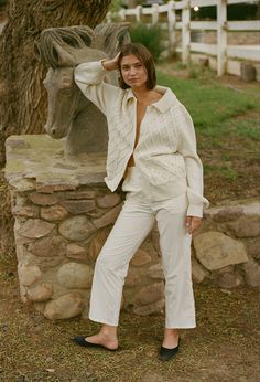 The Pietro Pant in Cream is a cotton straight leg, cropped pant featuring a button fly closure and elastic at the back waistband. Two side seam pockets. Fit: True to Size. Fit model wears size small.  Sizing: XS-L Materials: 100% Cotton Ivory Cardigan Outfit, Ciao Lucia, Ivory Cardigan, Chunky Cable Knit Sweater, Cardigan Outfit, Chunky Cable Knit, Romper Pants, Winter Fashion Outfits, Collar And Cuff