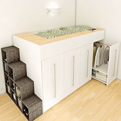 a bed that is in the middle of a room next to a book shelf and drawers