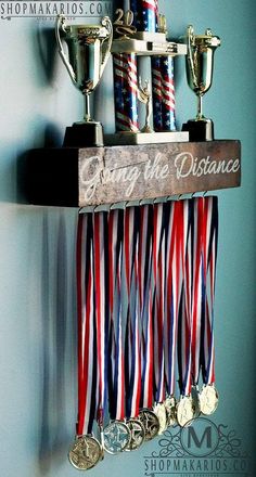 some medals are hanging on a wall