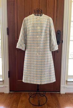 Vintage Nardis of Dallas jacket.  It looks like 1970's style.  Light blue and cream polyester material, opalescent buttons, unlined, with 3/4 length sleeves.  Excellent condition, no tears or stains.  There is no size tag inside, but I would say a medium fit.  Measurements are: Pit to pit 19" Total length 38" Sleeve 17" ( 3/4 length) Retro Long Sleeve Outerwear With Covered Buttons, Vintage Outerwear With Covered Buttons For Spring, Retro Spring Outerwear With Snap Buttons, Retro Cream Outerwear For Spring, Spring Retro Lined Outerwear, Vintage Spring Outerwear With Covered Buttons, Spring Cream Outerwear With Covered Buttons, Retro Beige Outerwear For Spring, Spring Outerwear With Button Closure And 3/4 Sleeve