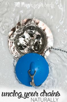 a blue object is in the middle of some water and it's attached to a chain