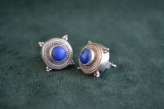 A pair of handmade lapis lazuli studs. Made completely with sterling silver (925 silver). Silver Round Byzantine Earrings, Byzantine Sterling Silver Jewelry With Matching Earrings, Silver Byzantine Gemstone Jewelry, Handmade Sterling Silver Byzantine Jewelry, Handmade Byzantine Style Sterling Silver Jewelry, Handmade Byzantine Sterling Silver Jewelry, Traditional Sterling Silver Cabochon Earrings, Traditional Blue Cabochon Jewelry, Byzantine Rings