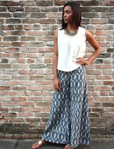 Wide leg, palazzo pants in an ikat grey diamond print. These super comfy, chic pants feature a flat front waistband in the front and an elastic waistband in the back. Available with or without the side slit on the outer leg. The slit reaches just below the knee and allows the pants to be tied up for a more funky look. If left untied the pants will elegantly flow in the wind like a maxi skirt. Fair trade. Handwoven ikat fabric. Palazzo Pants Outfit Indian, Palazzo Pants Outfit, Clothing Exchange, Outfit Indian, Chic Pants, Grey Pants, Palazzo Pants, Cotton Pants, Casual Look