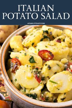 a close up of a bowl of food with text overlay that reads italian potato salad