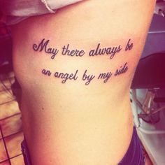 a woman with a tattoo saying, may there always be an angel by my side