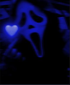 a blurry image of a ghost with a heart in it's mouth