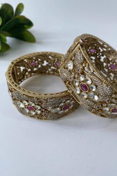 Gold polished bangles with zircon and kundan embellishments. - Aza Fashions Temple Jewelry Bangle With Stone Work For Reception, Traditional Stone Work Bangle For Reception, Traditional Heavy Bangle For Reception, Festive American Diamond Bracelets With Stone Work, Festive Traditional Bangle With American Diamond, Kundan Bangle With Stone Work For Reception, Stone Work Bracelets For Diwali Reception, Traditional Bangle With Tilla For Reception, Tilla Bangle For Reception And Festivals