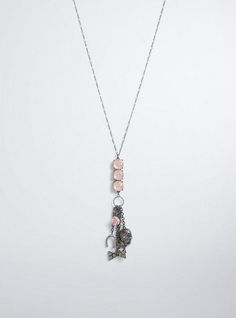 This necklace has a long hematite chain that extends into a trifecta of blush pink gemstones. But that's just the beginning! Attached to the feminine stones are a bevy of charms that include a pavé horseshoe, bow, and skull. Base metals. Imported. The best plus size women's gemstone pendant charm necklace pendants in hematite. Torrid is your destination for the freshest spring and summer styles. Earrings 2024, Love Keychain, Bracelet Inspo, Bracelets Ideas, Hair 2024, Beaded Boxes, Necklace Pendants, Summer Styles, Pink Gemstones