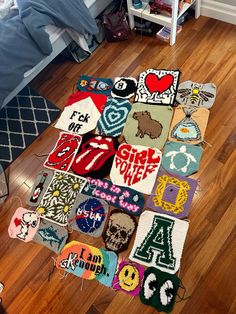 a pile of crocheted rugs sitting on top of a hard wood floor