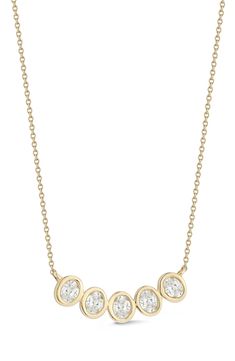 A curving line of oval bezels glints with inset diamonds at the center of this pendant necklace crafted from 14-karat gold. 16" length; 2" extender; 5/8"W x 1/4"L pendant Total diamond weight: 0.42ct. Color: G–H Clarity: SI 14k gold/diamond Imported >Diamond Guide Luxury Gold Diamond Necklace With Oval Pendant, Gold Diamond Necklace With Brilliant Cut Oval Pendant, Oval Diamond Necklace With Bezel Setting For Anniversary, Luxury Oval Pendant Necklace With Bezel Setting, Fine Jewelry Diamond Necklace With Oval Pendant, Anniversary Oval Necklace With Rose Cut Diamonds, Oval Diamond Necklace With Bezel Setting, Luxury Necklace With Oval Pendant And Bezel Setting, Luxury Oval Diamond Necklace With Bezel Setting