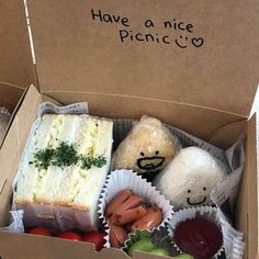 an open box with some food inside of it