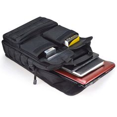 an electronic device and wallet sitting on top of each other in a black bag with zippers