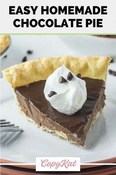 a slice of chocolate pie on a plate with whipped cream and chocolate chips around it