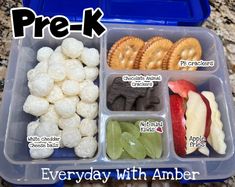 a lunch box filled with different types of snacks and pre - k treats in it