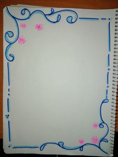 a white notebook with blue and pink flowers on it