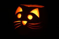 a carved pumpkin with a cat's face on it