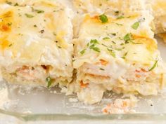 a casserole dish with cheese and herbs on top, ready to be eaten