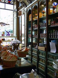 a store filled with lots of different types of bread and condiments on display