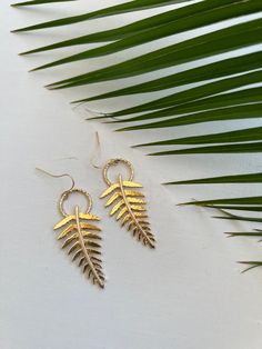 The fern is symbolic of everlasting youth. Many people believe that the fern represents new life and new beginnings. Handmade with Aloha. 14k gold plated. Hammered finish Gold Leaf Nature-inspired Jewelry, Nature-inspired Nickel-free Gold Earrings, Nature-inspired Gold Nickel-free Earrings, Nature-inspired Gold Leaf-shaped Jewelry, Nature-inspired Hypoallergenic Gold Jewelry, Hypoallergenic Gold Nature-inspired Jewelry, Hypoallergenic Nature-inspired Gold Jewelry, Gold Leaf-shaped Nature-inspired Earrings, Nature-inspired Gold Leaf-shaped Earrings