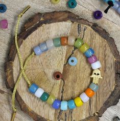 a wooden board with some beads on it