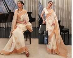 This Cream Copper Zari Woven Linen Saree gives a trendy, simple and classic look.This saree with its stylish patterns and attractive design will not fail to impress you. It adds a splash of vibrancy and charm to your casual dapper looks for the season. The silk blend is soft, fine and skin friendly which gives you a relaxed and comfortable feel. Combine this gorgeous saree with gold and silver colored jewellery, bangles and a matching pouch to create a complete look. Comes with matching blouse. The unstitched blouse can be customized upto 44 inches. Do Note: All the accessories shown are for styling purpose only. Slight color variation may occur due to photographic reasons. Fall and Pico : Done Draping Saree(Ready to wear) : On Request Extra Charges Occasion : Bridal Wear, Wedding, Party, Bollywood Style Formal Blouse Piece For Eid, Formal Cutdana Blouse Piece For Eid, Elegant Chanderi Blouse For Formal Occasions, Bollywood Style Blouse Piece For Diwali And Formal Occasions, Formal Unstitched Blouse For Eid, Elegant Chanderi Formal Blouse, Elegant Blouse Piece For Formal Navratri, Bollywood-style Formal Blouse Piece For Diwali, Elegant Formal Blouse Piece For Navratri