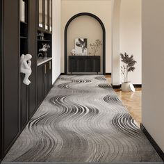 the hallway is clean and ready for guests to use it as an entrance way in this modern home