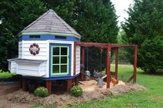 there is a small chicken house in the yard