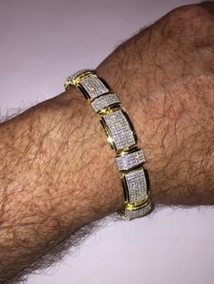 "This listing is for a stunning iced out solid 925 Sterling silver bracelet that comes in 2 finishes: rhodium (white) or 14k yellow gold finish. Bracelet is adorned with 12 carats of man-made diamond, making it super icy! Weight is approximately 31 grams and thickness is 12.5mm wide. 8.5\" length FREE SHIPPING IN THE US!!" Diamond Bracelets For Men Unique, Gold Iced Out Round Tennis Bracelet, Diamond White Iced Out Cubic Zirconia Bracelets, Gold Iced Out Diamond Bracelet, Iced Out Diamond White Cubic Zirconia Bracelets, Gold Iced Cuban Link Jewelry, Iced Gold Cuban Link Jewelry, Gold Iced Out Tennis Bracelet For Anniversary, Iced Out Diamond White Cubic Zirconia Tennis Bracelet