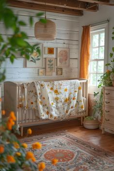 a baby crib in the corner of a room with yellow flowers and greenery