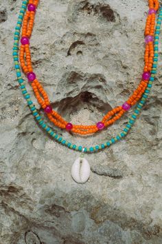 Elevate your beach ensemble with the Elsa Shell Necklace (named after our favourite Ibu). Made from recycled polyester beads, it's a sustainable and stylish choice. Rock it solo or layer it with our Balik Double Beaded Necklace for a vibrant summer vibe. Summer Multi-strand Colorful Beaded Necklaces, Hippie Multicolor Beach Necklaces, Coastal Strand Necklace For Summer, Summer Coastal Strand Necklace, Multicolor Large Beads Necklace For Vacation, Summer Shell Necklace For Vacation, Multi-strand Beaded Necklaces For Summer, Multicolor Large Beaded Necklaces For Vacation, Handmade Necklaces For Summer Beach Parties