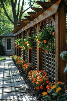 an outdoor garden with flowers and trelliss on the side of the building,