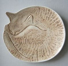 a white plate with a cat design on it