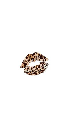 a pair of leopard print hair clips on a white background with an animal print pattern