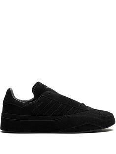 black calf suede round toe logo-debossed tongue signature 3-Stripes logo debossed logo to the side contrast lining branded leather insole rubber sole front lace-up fastening This piece comes complete with a protective dust bag. Black Slip-on Sneakers With Textured Sole For Streetwear, Black Suede Lace-up Sneakers, Black Slip-on Sneakers For Streetwear With Vibram Sole, Luxury Black Suede Sneakers, Y-3 Adidas Yohji Yamamoto, Debossed Logo, Aviator Watch, Adidas X, Balenciaga Triple S