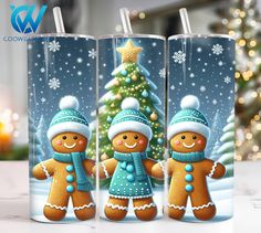 three christmas mugs with gingerbread characters in front of a christmas tree and snowflakes