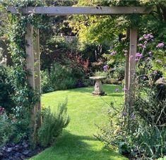 a garden with lots of green grass and flowers