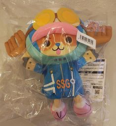 a stuffed animal is wrapped in plastic