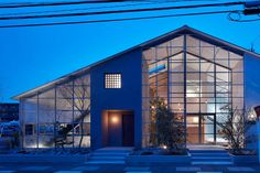 a blue house is lit up at night