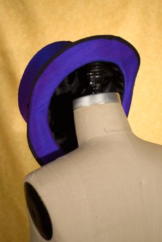 This is a listing for a custom hat and includes virtually any style of Top Hat that you can imagine. We can make hats in all different colors, heights, and shapes. The pictures above show a top hat that is hand sewn from silk with a buckram and wire frame. These hats are totally different than a felt top hat. Contact us in advance to discuss design or we can work with you after you order to get the perfect look. -------------------------------------------------------------- When we opened our me Bespoke Flat Brim Hat, Handmade Fitted High Crown Mini Hats, Handmade Fitted Mini Hat With High Crown, Handmade Fitted Felt Hat With Short Brim, Blue Fitted Wide Brim Cloche Hat, Blue Wide Brim Cloche Hat, Handmade Fitted Brimmed Felt Hat, Handmade Fitted Hat With Curved Brim, Fitted Blue Brimmed Fedora