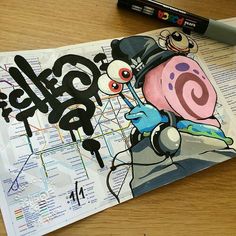 a piece of paper with an image of a cartoon character on it next to a marker pen