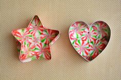 two small heart shaped dishes sitting next to each other