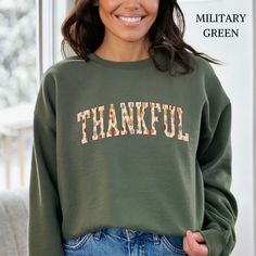 Enjoy this Fall Season with my gorgeous Thankful Gildan crewneck sweatshirts for men & women. This sweater features the popular curved College Font with lettering patterned with leaves in fun fall colors. A lovely way to show off your Thankful Vibes this year, and makes a great Fall or Thanksgiving gift for friends & family. There are so many things to be thankful & grateful for...wear it loud & proud.  Sizing: These sweatshirts fit somewhat loose, and are generally true to size. For an oversize Fall College Crew Neck Sweats, Relaxed Fit Letter Print Sweats For Fall, Fall College Crew Neck Sweatshirt, Fall Crew Neck Sweatshirt For College, Crew Neck Fall Sweatshirt For College, Fall Crew Neck Sweatshirt With Lettering, Fall Crew Neck Sweats With Letter Print, Crew Neck Letter Print Sweatshirt For Fall, Green Crew Neck Sweats For Fall