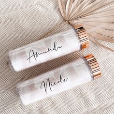 two personalized white and rose gold travel tumbles with palm leaves on the side