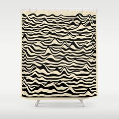 a black and white shower curtain with wavy lines