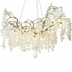 a chandelier with white beads hanging from the ceiling