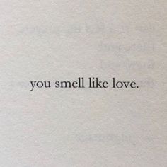 the words you smell like love are written in black ink