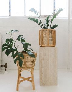 two wooden planters sitting next to each other on top of a white tiled floor